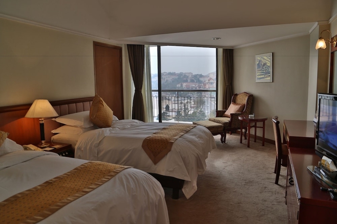Imagen de la habitación del Hotel Huiquan Dynasty. Foto 11
