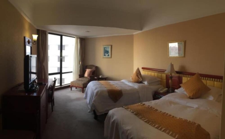 Imagen de la habitación del Hotel Huiquan Dynasty. Foto 13