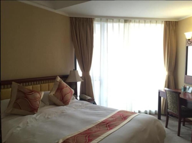 Imagen de la habitación del Hotel Huiquan Dynasty. Foto 14