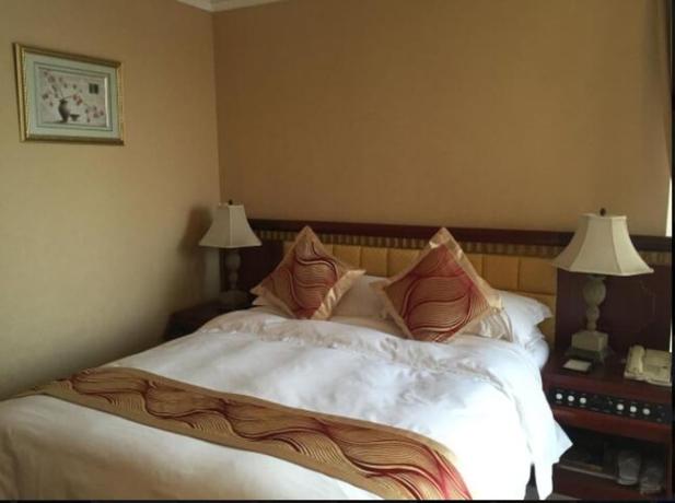 Imagen de la habitación del Hotel Huiquan Dynasty. Foto 15