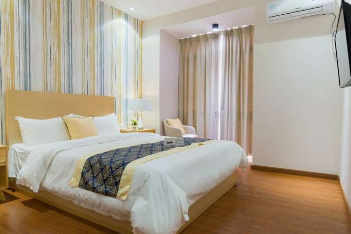 Imagen de la habitación del Hotel Huizhou Qu Wo Jia Shang Pin Apartment. Foto 16