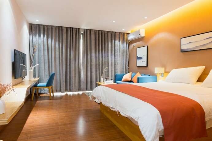 Imagen de la habitación del Hotel Huizhou Qu Wo Jia Shang Pin Apartment. Foto 18