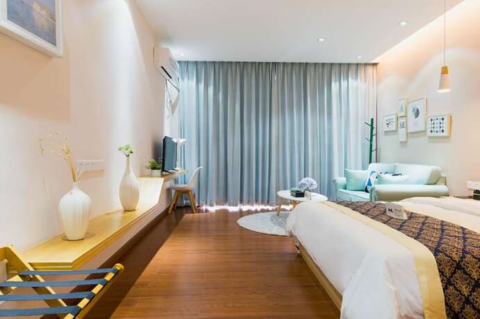 Imagen de la habitación del Hotel Huizhou Qu Wo Jia Shang Pin Apartment. Foto 20