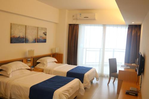 Imagen de la habitación del Hotel Huizhou Sea Park Holiday. Foto 6