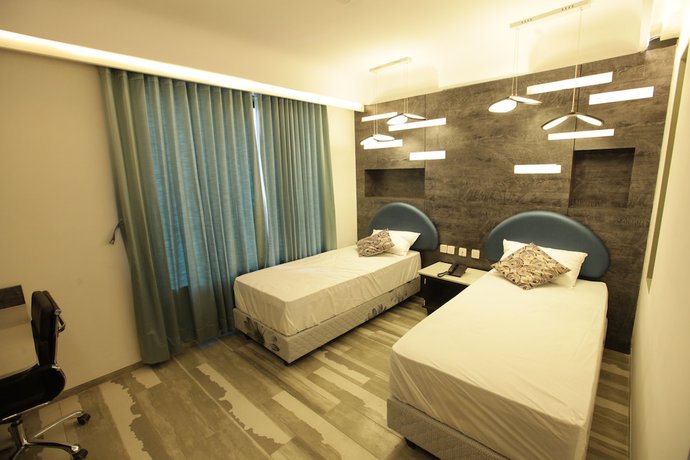 Imagen de la habitación del Hotel Humming Bird and Banquet. Foto 12