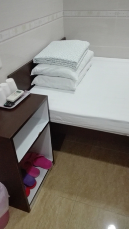Imagen de la habitación del Hotel Hung Kiu Guest House. Foto 4