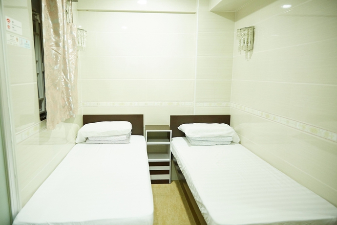 Imagen de la habitación del Hotel Hung Kiu Guest House. Foto 9