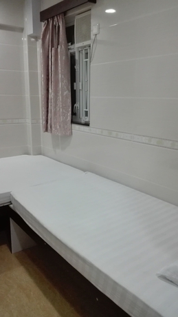 Imagen de la habitación del Hotel Hung Kiu Guest House. Foto 14