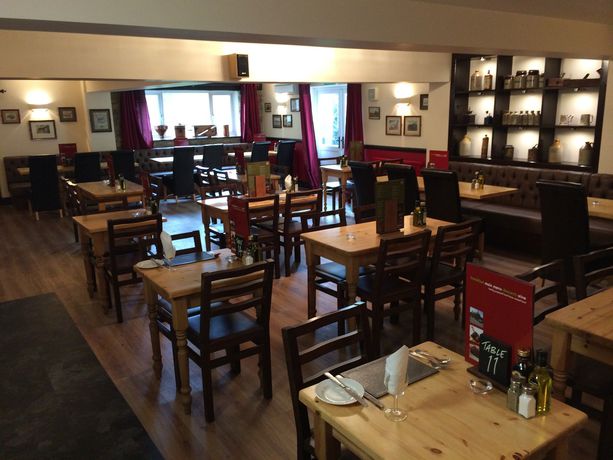 Imagen del bar/restaurante del Hotel Hunters Lodge Inn. Foto 4