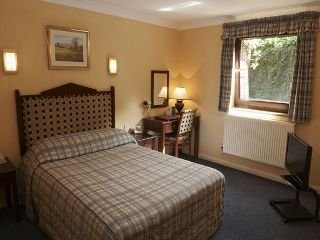 Imagen de la habitación del Hotel Hunting Lodge Hotel. Foto 4