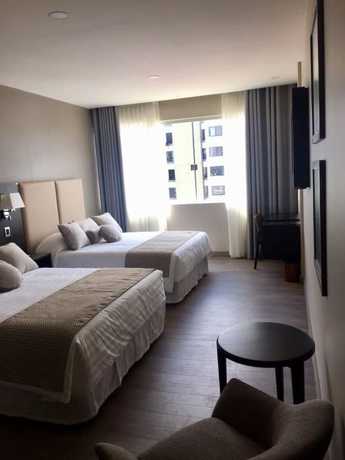 Imagen de la habitación del Hotel Huper Boutique. Foto 15