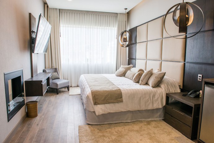Imagen de la habitación del Hotel Huper Boutique. Foto 16