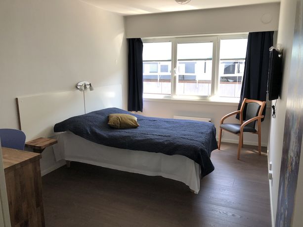 Imagen de la habitación del Hotel Husnes Sentruml. Foto 2