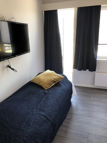 Imagen de la habitación del Hotel Husnes Sentruml. Foto 15