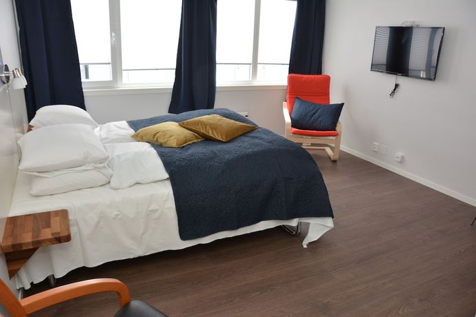 Imagen de la habitación del Hotel Husnes Sentruml. Foto 16