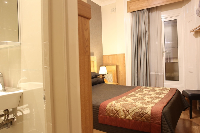 Imagen de la habitación del Hotel Huttons. Foto 10