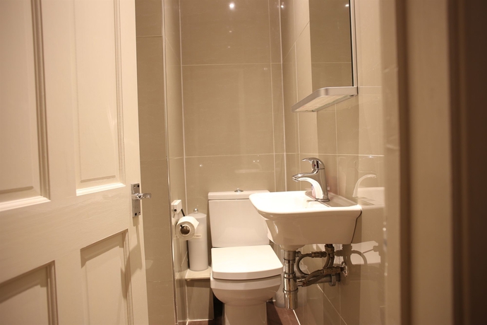 Imagen de la habitación del Hotel Huttons. Foto 11