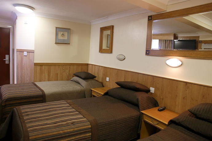 Imagen de la habitación del Hotel Huttons. Foto 12