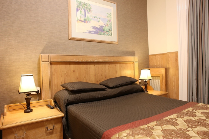 Imagen de la habitación del Hotel Huttons. Foto 13