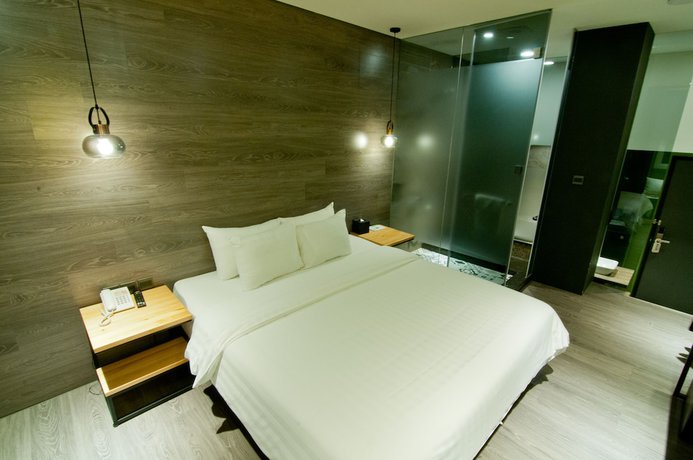 Imagen de la habitación del Hotel Huwei. Foto 7