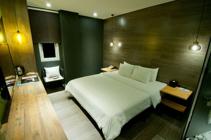 Imagen de la habitación del Hotel Huwei. Foto 9