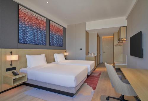 Imagen de la habitación del Hotel Hyatt Place Yantai Development Zone. Foto 20