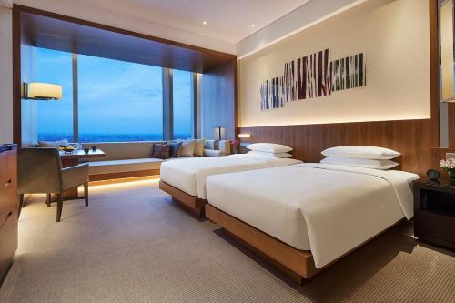 Imagen de la habitación del Hotel Hyatt Regency Changchun. Foto 6