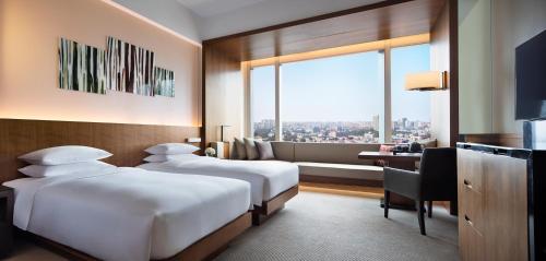 Imagen de la habitación del Hotel Hyatt Regency Changchun. Foto 7