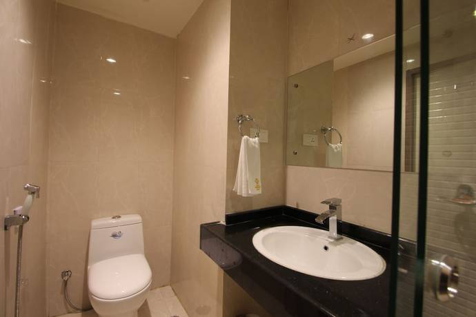 Imagen de la habitación del Hotel Hyderabad Grand. Foto 11