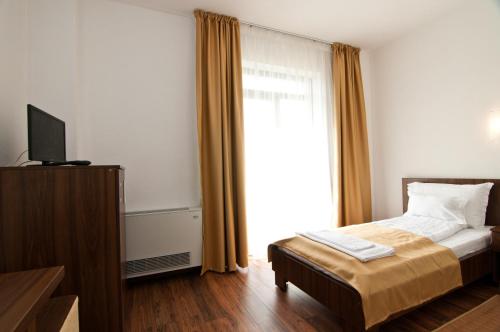 Imagen de la habitación del Hotel Hyperion. Foto 8