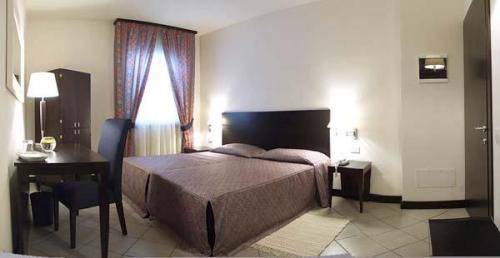 Imagen de la habitación del Hotel I' Fiorino. Foto 13