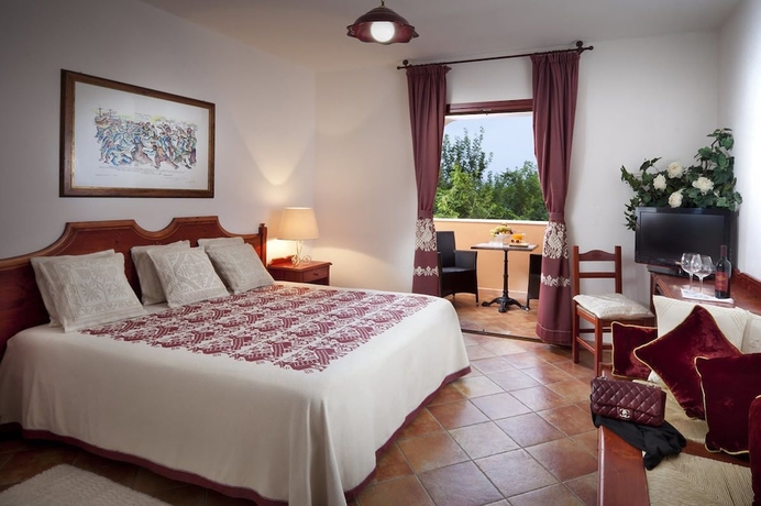 Imagen de la habitación del Hotel I Giardini Di Cala Ginepro Resort. Foto 13