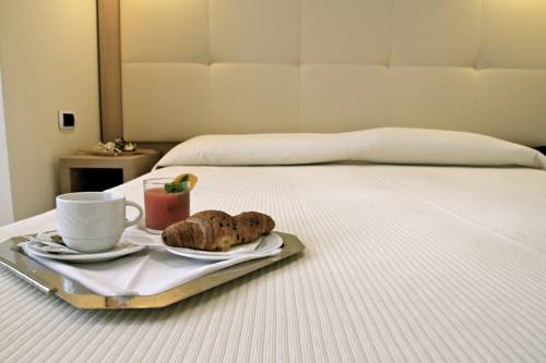 Imagen de la habitación del Hotel I Ginepri, Marina Di Castagneto Carducci. Foto 12