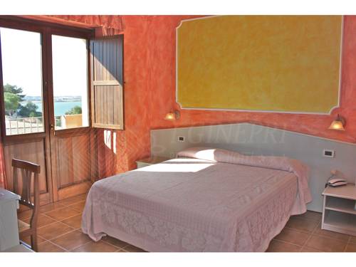 Imagen de la habitación del Hotel I Ginepri, QUARTU SANT'ELENA. Foto 7