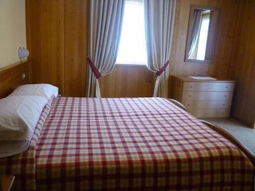 Imagen de la habitación del Hotel I Rododendri. Foto 6