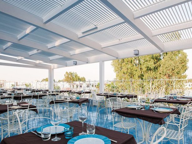 Imagen del bar/restaurante del Hotel I Turchesi Club Village. Foto 3