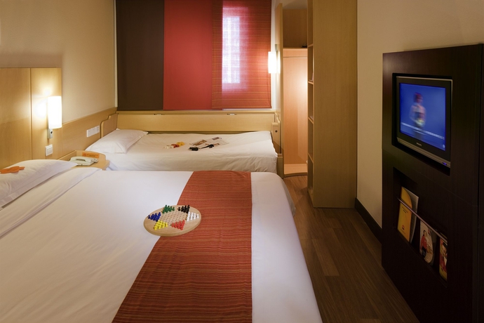 Imagen de la habitación del Hotel IBIS BEIJING SANYUAN. Foto 11