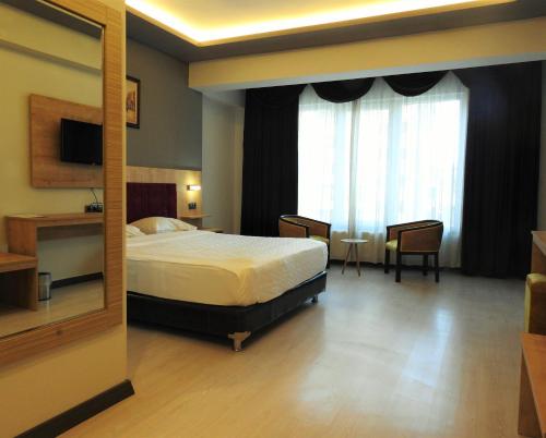 Imagen de la habitación del Hotel INN TOWN HOTEL. Foto 19