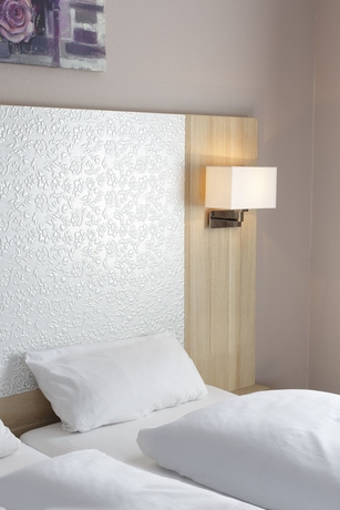 Imagen de la habitación del Hotel INVITE Löwen. Foto 7