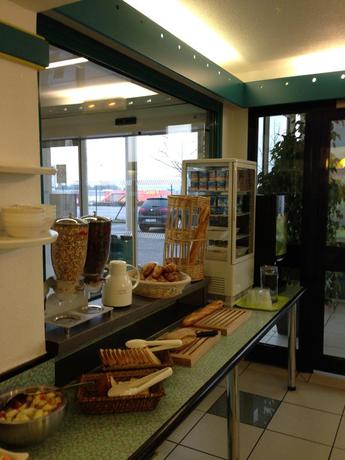 Imagen del bar/restaurante del Hotel Ibis Budget Poitiers Nord Futuroscope. Foto 2