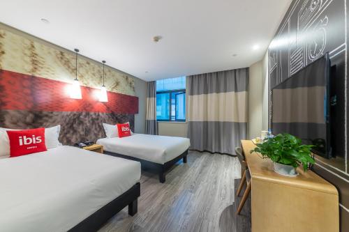 Imagen de la habitación del Hotel Ibis Chongqing Jiefangbei Pedestrian Street. Foto 6