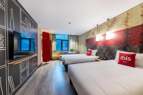 Imagen de la habitación del Hotel Ibis Chongqing Jiefangbei Pedestrian Street. Foto 8