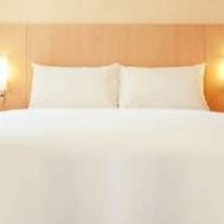 Imagen de la habitación del Hotel Ibis Dalian Zhongshan Square. Foto 6