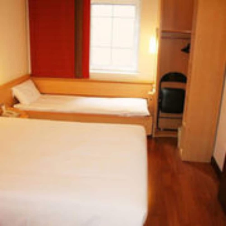 Imagen de la habitación del Hotel Ibis Dalian Zhongshan Square. Foto 11