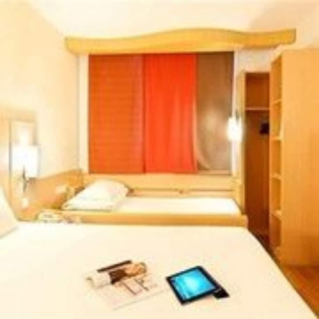 Imagen de la habitación del Hotel Ibis Dalian Zhongshan Square. Foto 13
