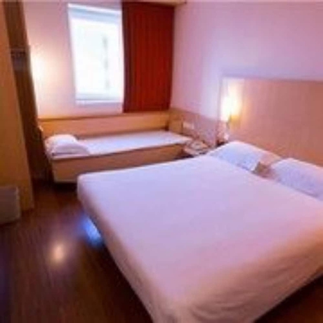 Imagen de la habitación del Hotel Ibis Dalian Zhongshan Square. Foto 14