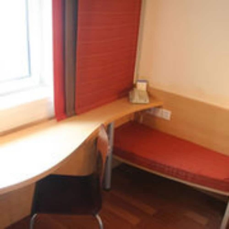 Imagen de la habitación del Hotel Ibis Dalian Zhongshan Square. Foto 16