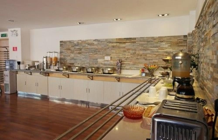 Imagen del bar/restaurante del Hotel Ibis Dalian Zhongshan Square. Foto 3