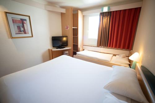 Imagen de la habitación del Hotel Ibis Fribourg. Foto 5