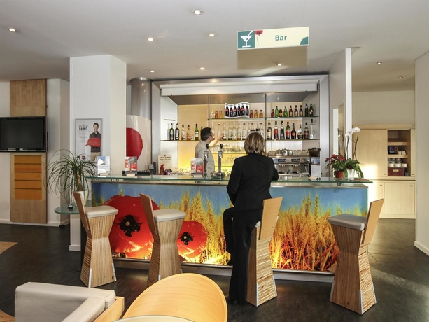 Imagen del bar/restaurante del Hotel Ibis Lyon Sud Vienne Saint Louis. Foto 11